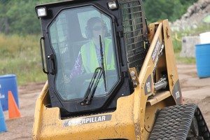 Powersports Business managing editor Liz Keener took on a skid steer and an excavator during her time at the Extreme Sandbox in Hastings, Minn. 