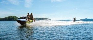 The Sea-Doo WAKE 155, built on the GTI platform, provides plenty of power for weekend warriors, here with two adults seated on the Sea-Doo and a third being towed.