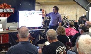 Tim McKeever, marketing manager at Gowanda Harley-Davidson in New York, points out Facebook features to customers during the dealership’s Facebook 101 session.