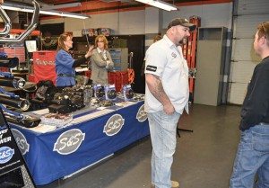 Jeremy Gilbert, sales manager at S&S Cycle, listens to a customer at the Backstage Pass to Service event at St. Paul Harley-Davidson.