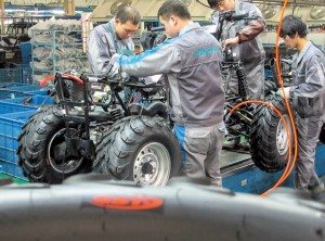 CFMOTO workers assemble an ATV for the Russian market.