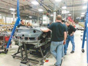 A group of Gibbs employees runs quality checks on a Quadski at the company’s Auburn Hills, Mich., facility, where it employs a staff of about 150. 