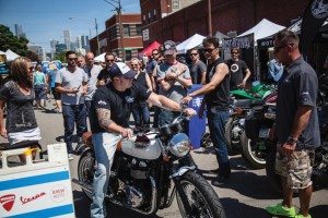 A member of the Team Triumph dealership shows off his group’s creation, “Gypsy,” to the crowd at Motoblot, which was held June 13-15 in Chicago.