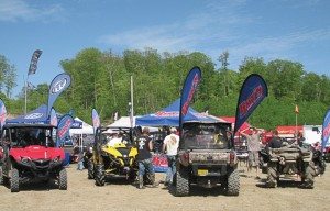 Ray’s Sport & Cycle of Grand Rapids, Minn., used large flags affixed to its units to draw attention to its dealership at Quadna Mud Nationals in Hill City, Minn.