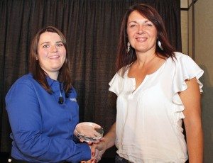 Nora Roberts, office manager of Rec-Tech Power Products in Alberta, accepts the dealership’s Best in Class award for Customer Service from Powersports Business managing editor Liz Keener at the 2013 Power 50 celebration. 