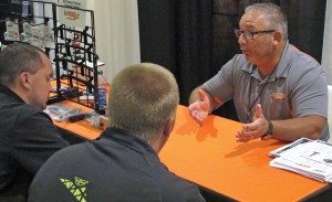 Larry Tiede of Woody’s met with WPS sales reps during the distributor’s snowmobile dealer show in Minneapolis last month.