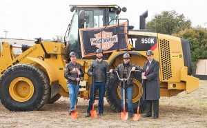 Harley-Davidson district manager Gary Barnes, Texas Harley-Davidson general manager Neil Noble, Texas Harley-Davidson owner Adam Smith and Bedford mayor Jim Griffin prepared to break ground at the dealership’s new location. Adam’s custom-made shovel “handlebar” was particularly effective.