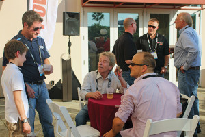 Kevin Cooper (left) of Manheim Specialty Auctions talks with attendees at the Manheim-sponsored Powersports Business Institute @ AIMExpo Kickoff Networking Reception in October.