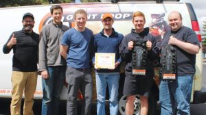 The Giant Loop team was proud to show offits 2016 Powersports Business Nifty 50 Award for its Fandango Tank Bag Pro. (From left) Harold Olaf Cecil, Giant Loop owner/founder; George Craig, operations manager; Dan Price, warehouse;  Brian Frankle, design director; Dakota Buer, warehouse; and Paul Robson, production manager.