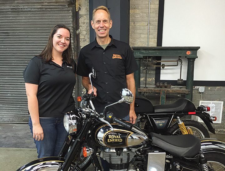 Kate Swanson and Royal Enfield North America president Rod Copes at the grand opening of the North American headquarters in Milwaukee.