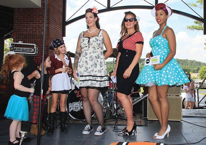 Among the activities at the annual Rockabilly Rumble, the dealership hosts a pin-up girl contest during the event.
