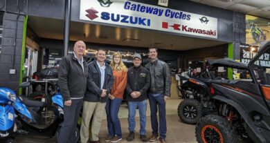 Gateway Cycles owners stand in showroom